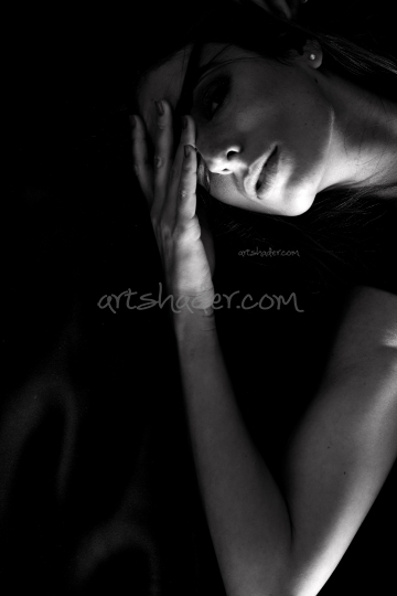 Emotive dark Portrait of a beautiful young woman	