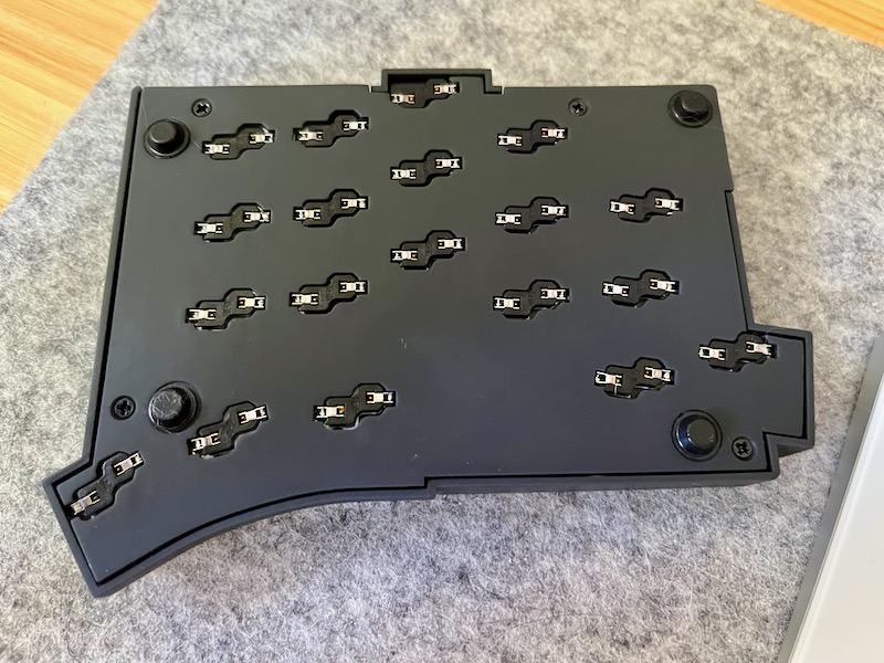 Back of case with cutouts for keyswitch sockets