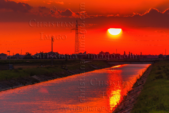 sunset sky on irrigation channel