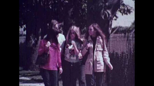 Teenagers, Walking Down Street, Hit By a Strong Gust of Wind, USA, 1970s