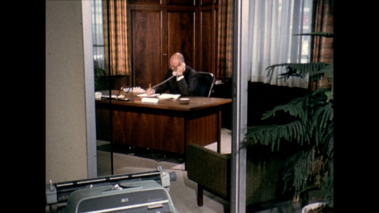 Business executive Talking on Telephone in Office, USA, 1960s 
