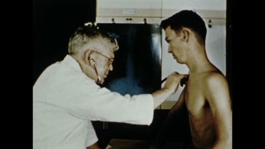 Doctor Examines Young Man, Patient For Tuberculosis, Mobile Xray Laboratory, USA, 1950s