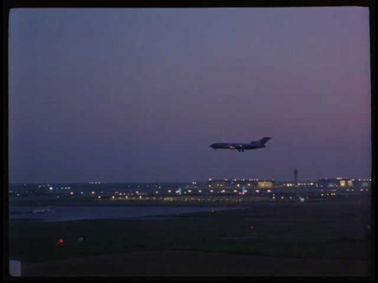 Plane Landing at Dallas-Fort Worth Airport, Night, USA, 1990s