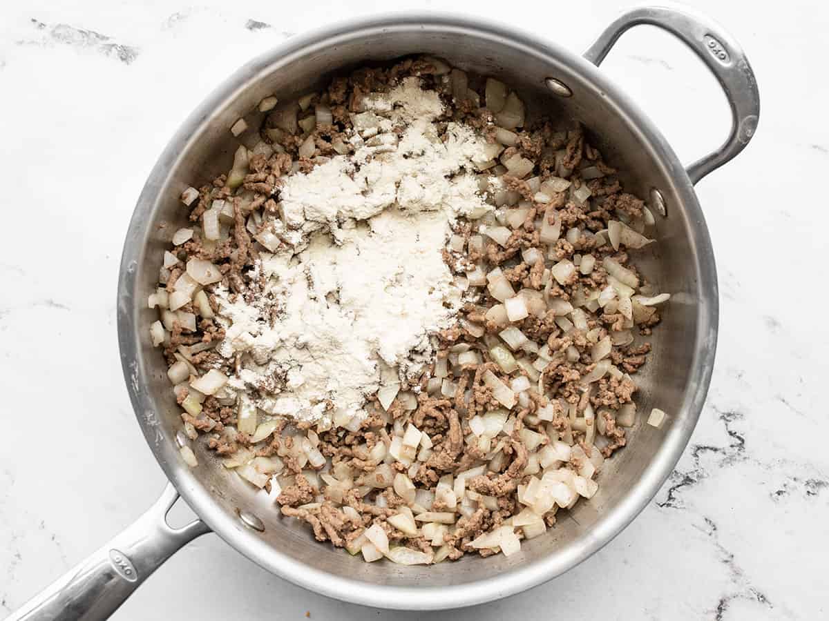 Image of Add the flour to the skillet and continue to stir...