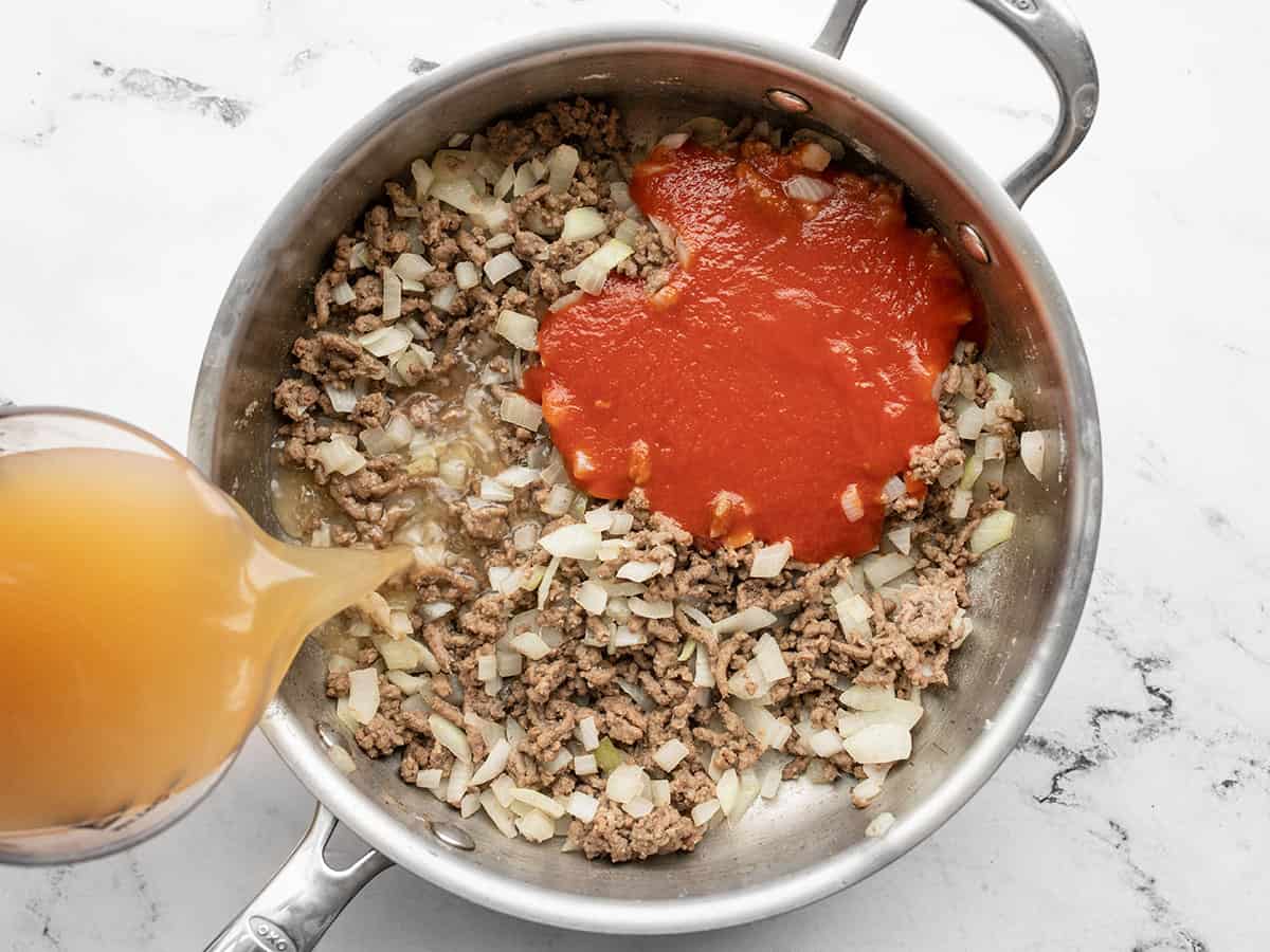 Image of Add the tomato sauce and beef broth to the skillet...