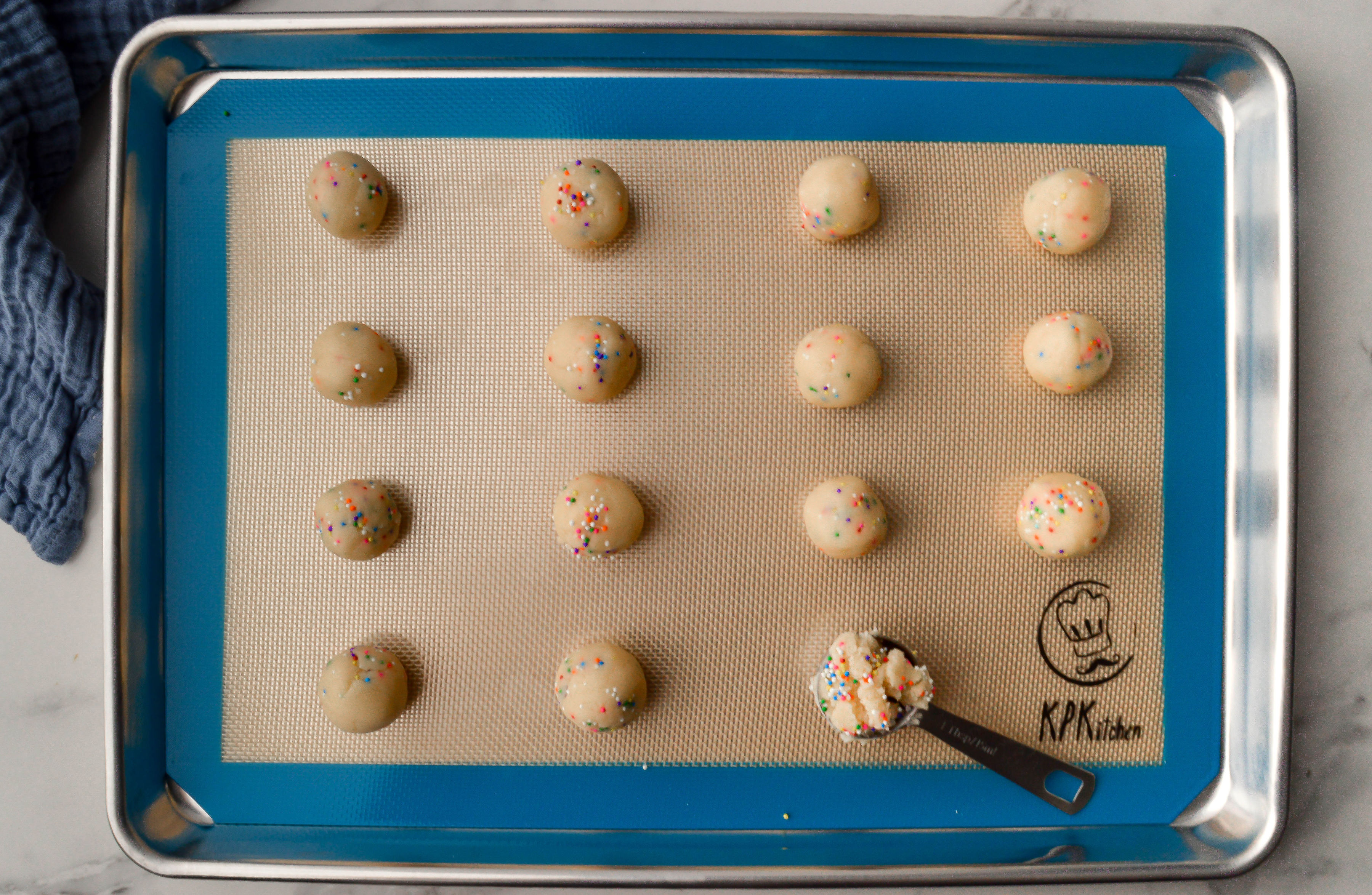 Image of Roll 1 tablespoon of dough into balls and place them...