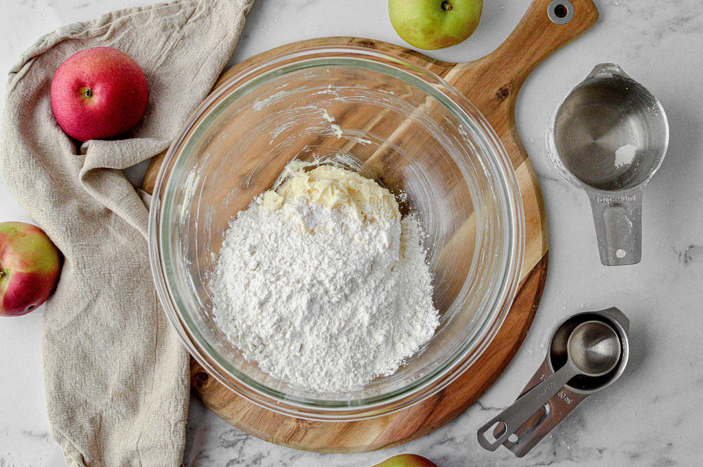 Image of Slowly add the flour and mix until a dough forms....