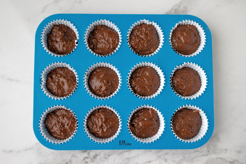 Image of Pour the batter evenly into each KPKitchen cupcake cup.