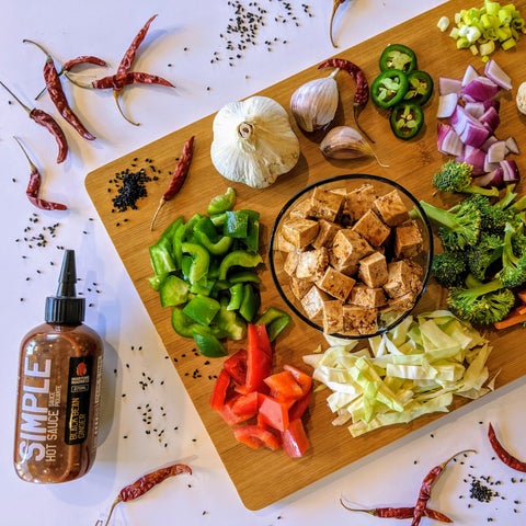 Image of Add veggies back into Wok with tofu and mix together....