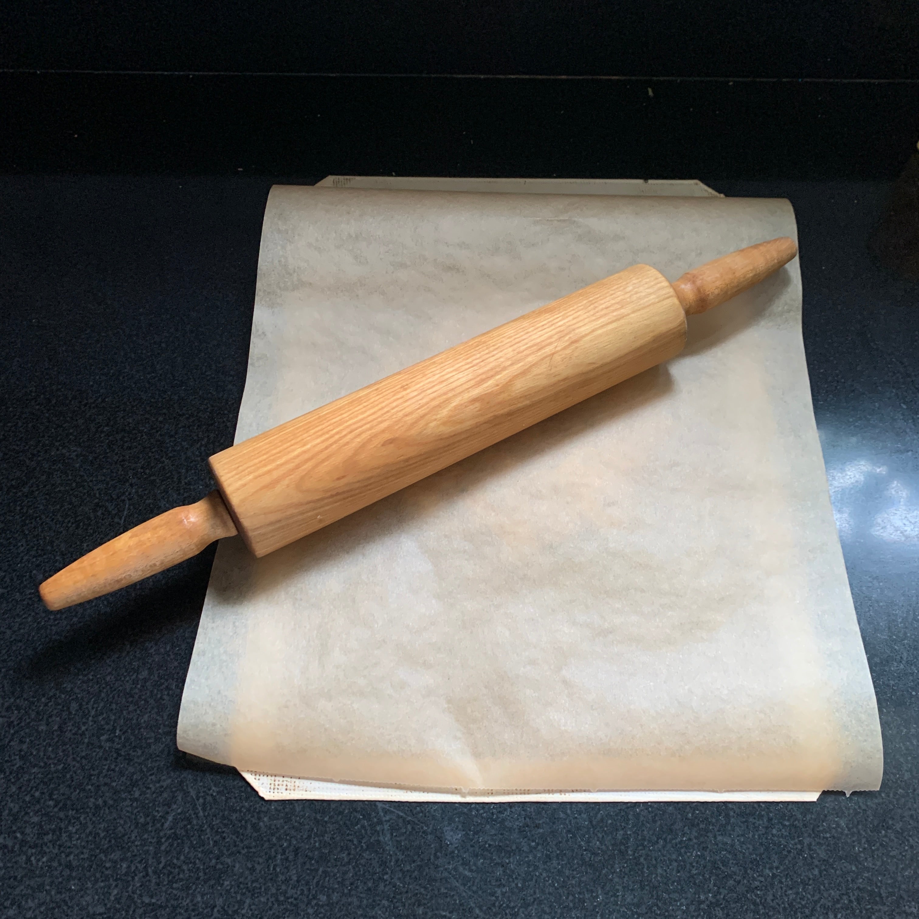 Image of Cover with a piece of parchment paper and gently roll...