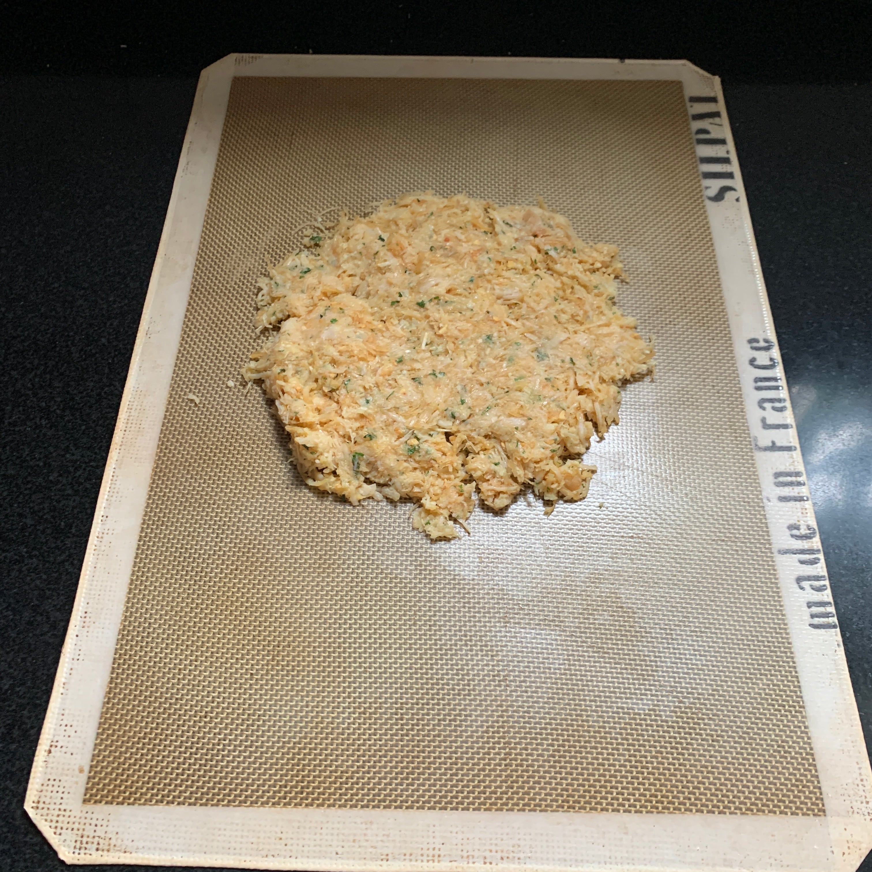 Image of Lay on a silicone baking sheet, cover with parchment paper...