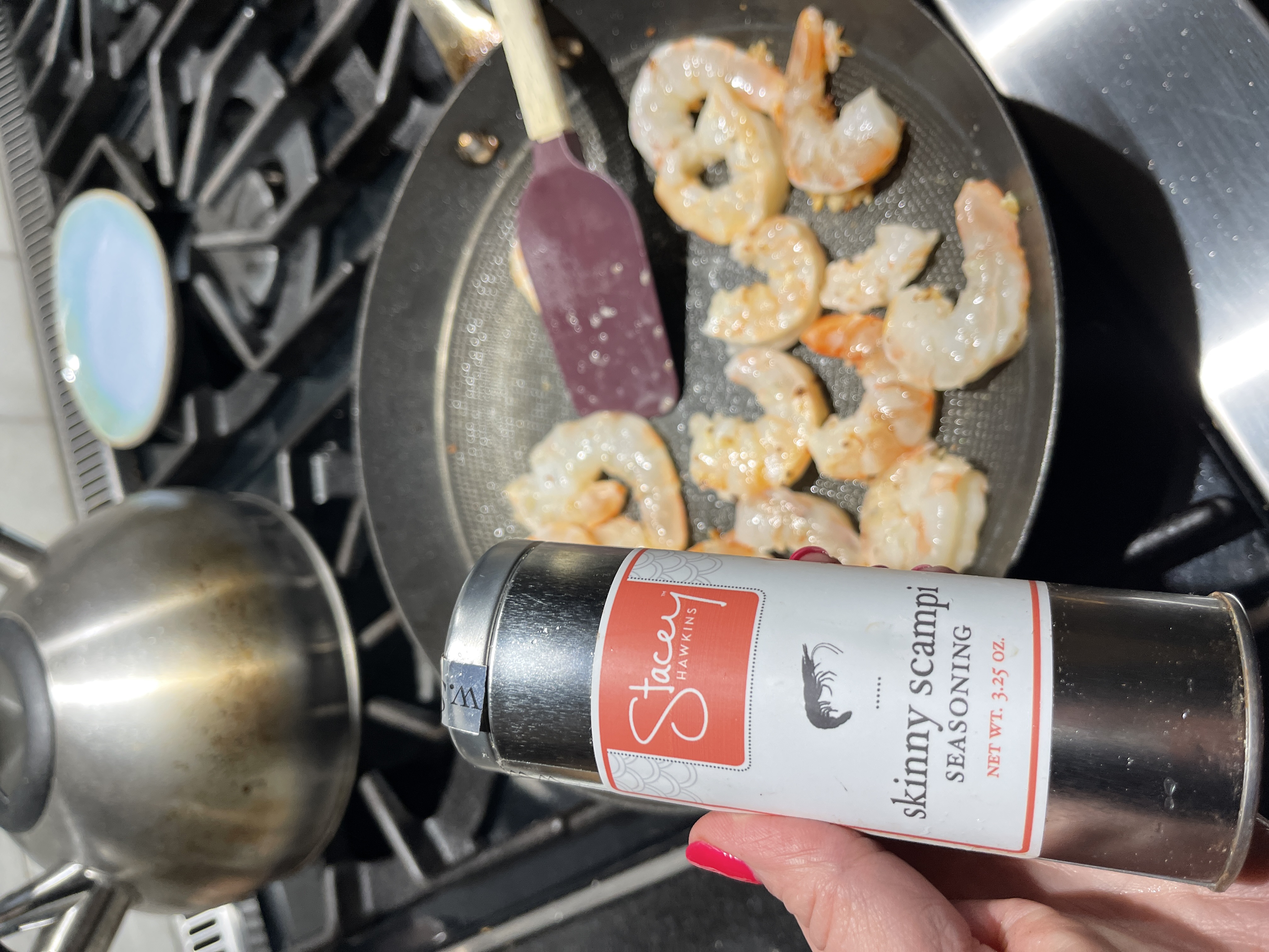 Image of Add shrimp to the pan and sprinkle with Skinny Scampi...