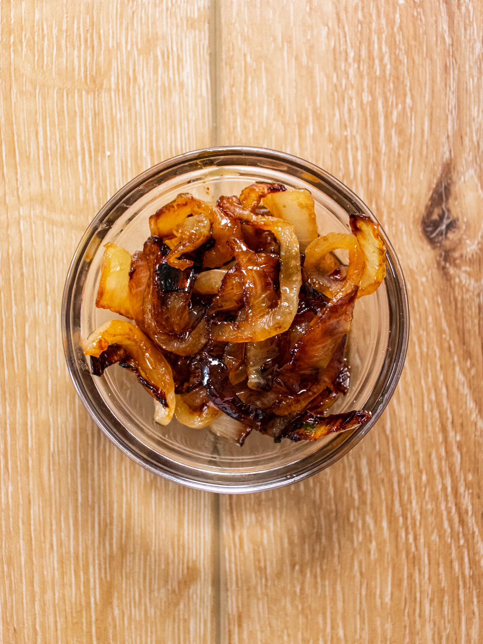 Image of While onions cook, combine ingredients for burgers in a large...