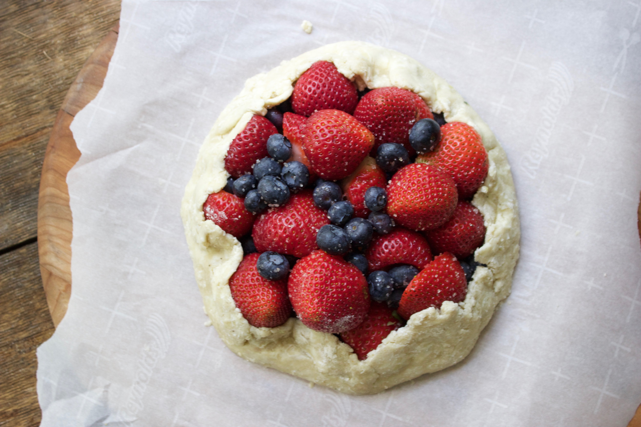 Image of Begin to fold over edges of dough into center of...