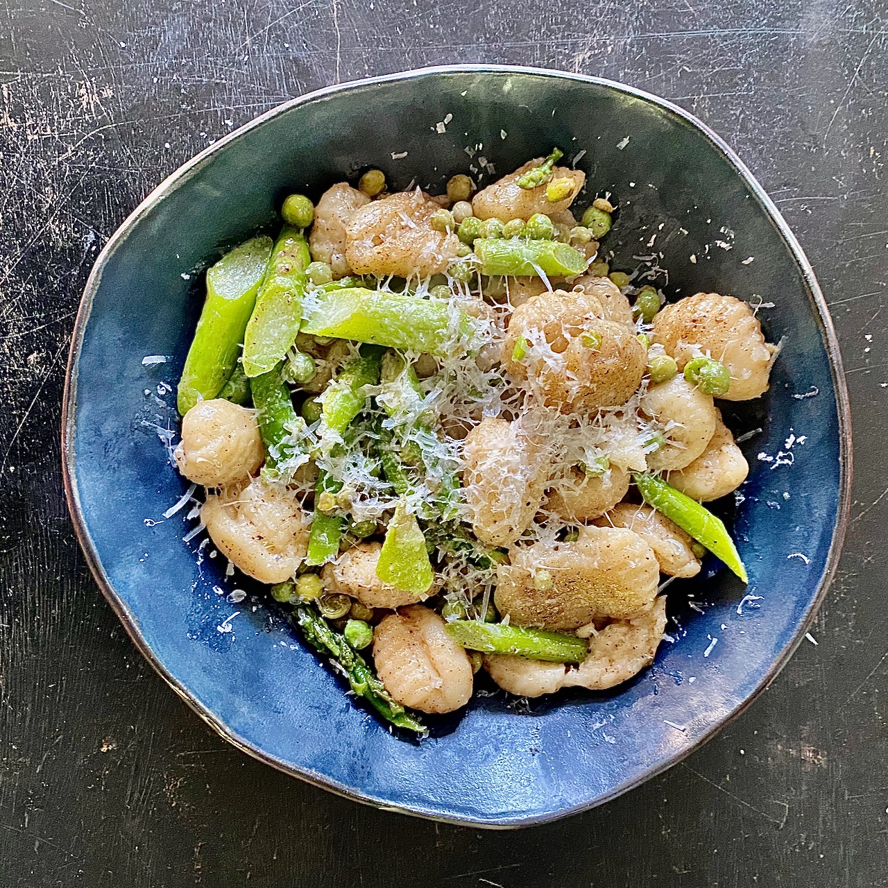 Image of Transfer to a warm plate and top with parmesan cheese.