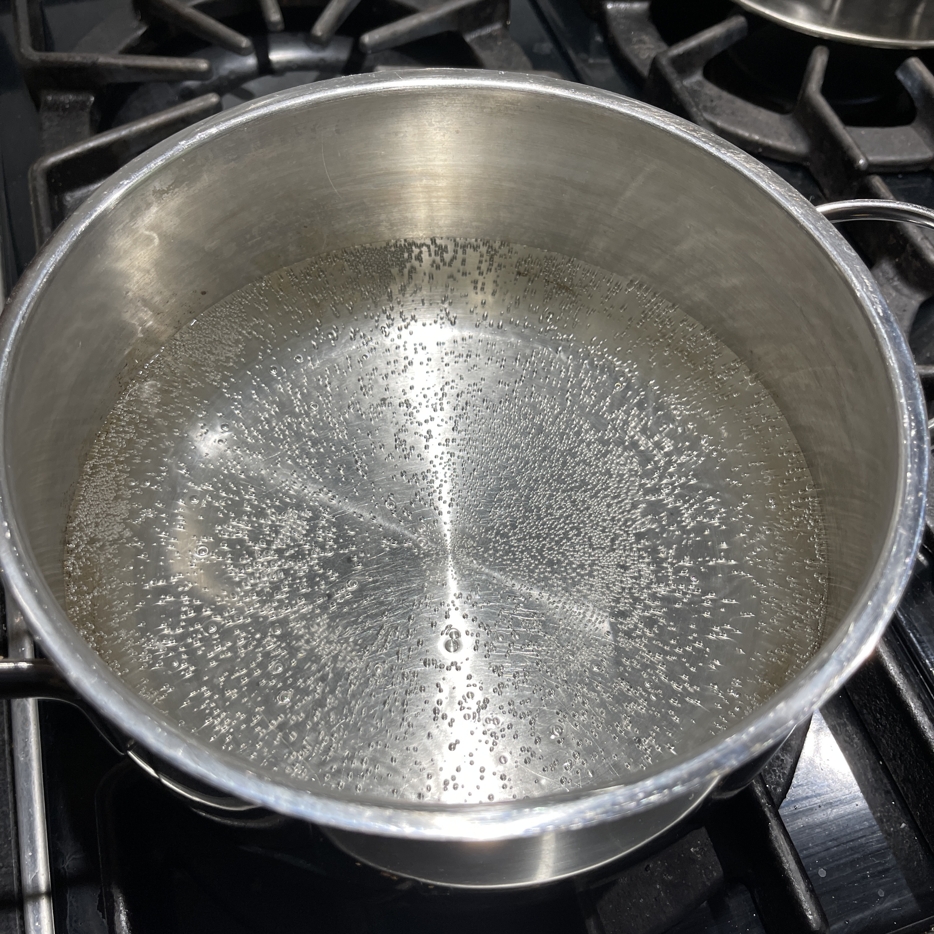Image of Place water and vinegar into a pot. Turn on high...