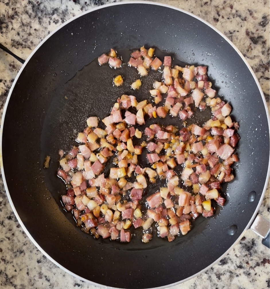 Image of In a large skillet over medium heat, render pancetta down....