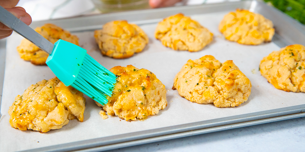 Image of Drizzle the butter mixture over each biscuit.  Serve warm.