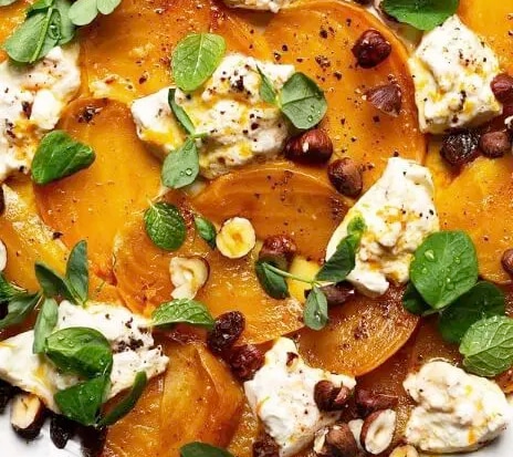 Photo of Spiced Golden Beets & Burrata with Hazelnuts, Golden Raisins and White Balsamic Orange Drizzle