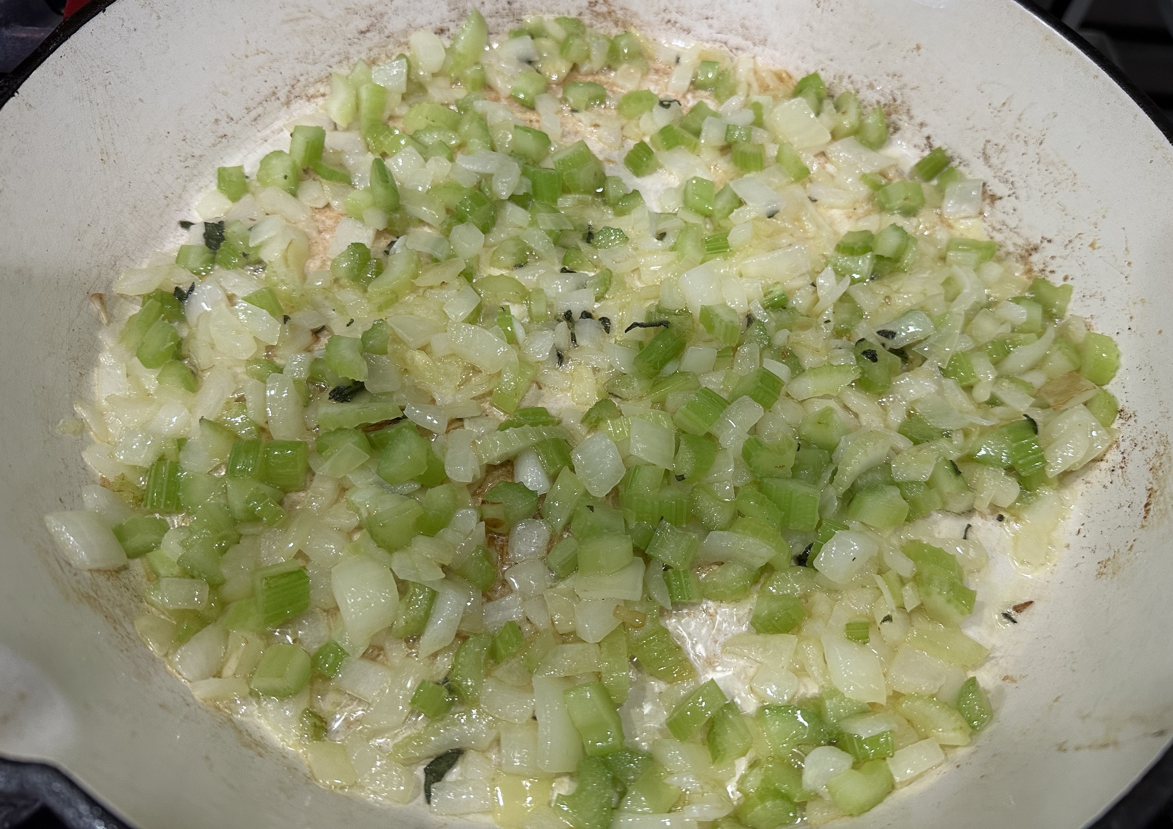 Image of Melt butter in a large skillet over medium heat. Sauté...