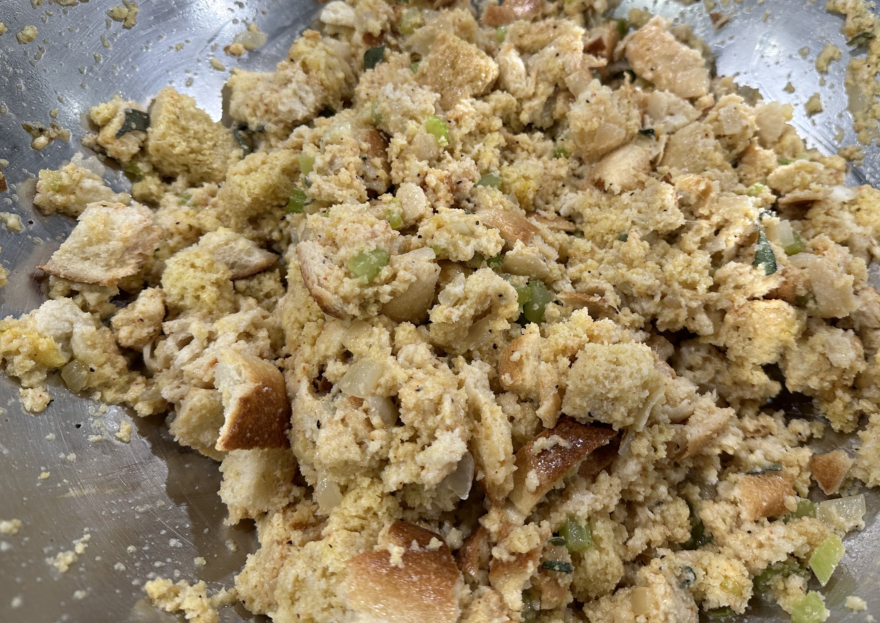 Image of Add onion and celery to the mixing bowl. Stir in...