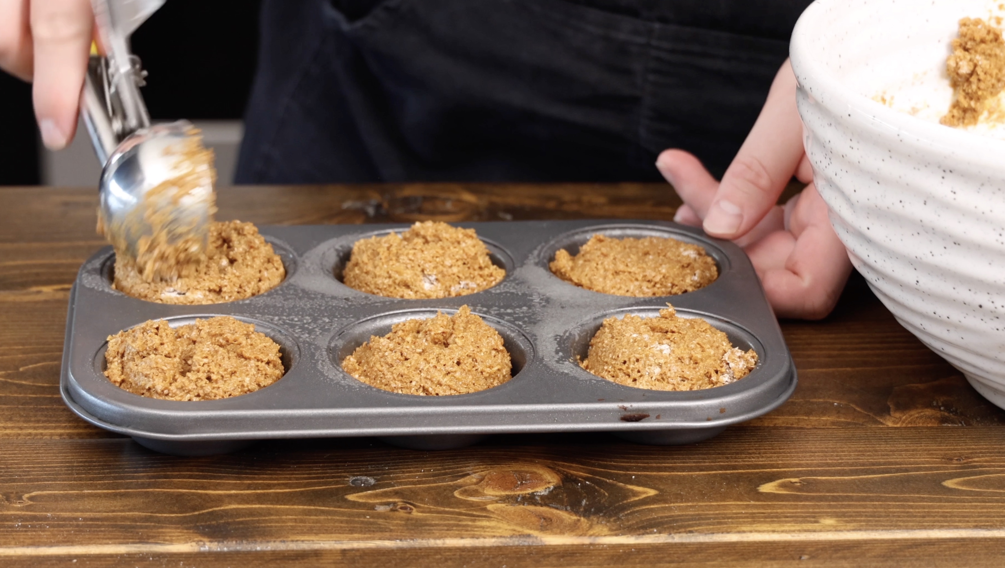 Image of Heap the batter evenly into the wells of the muffin...