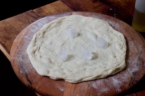 Image of Drizzle the dough lightly with olive oil. Next, add three...