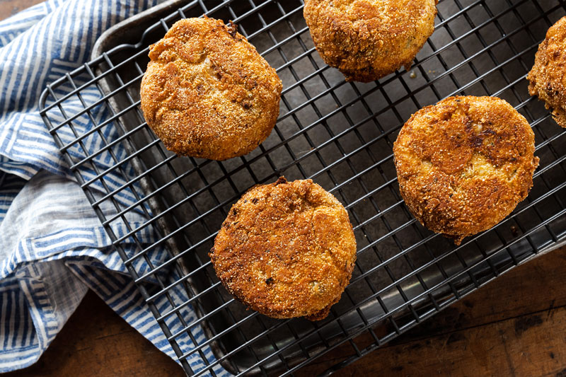 Image of Place a metal cooling rack over a rimmed baking sheet....