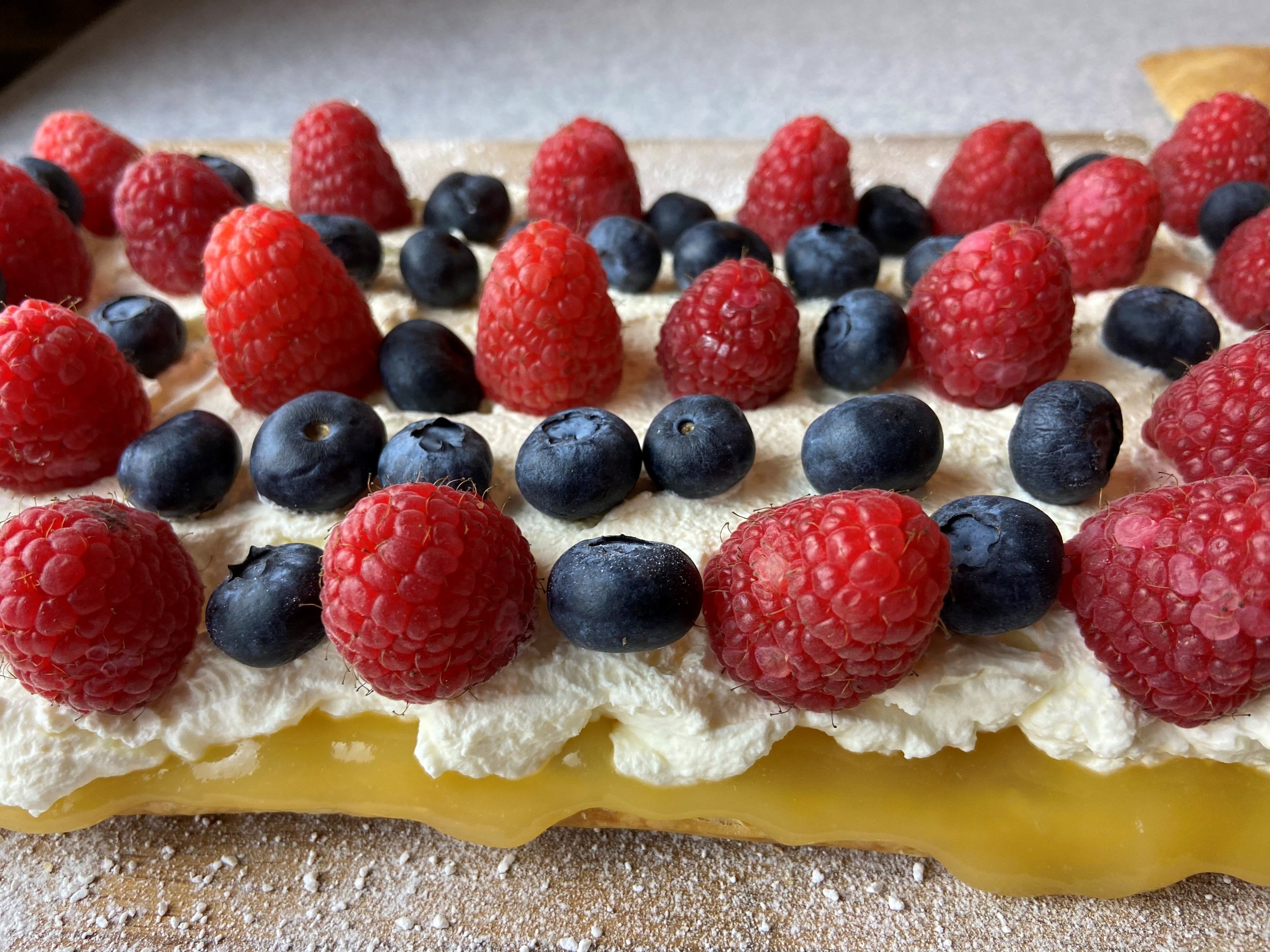 Image of Cover with fresh raspberries and blueberries
