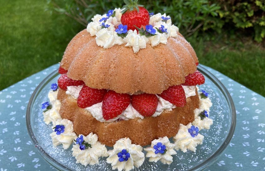 Image of Decorate the cake with more strawberries, cream rosettes and fresh...