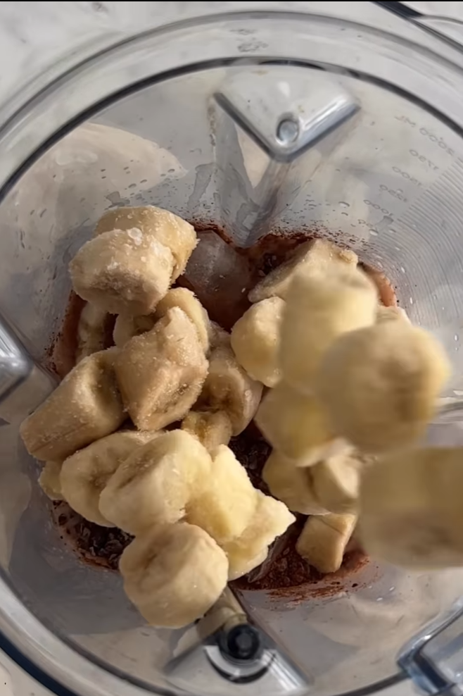 Image of Add STRENGTH, frozen bananas, ice and cashew butter to blender.