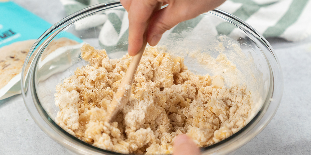 Image of Divide the dough in half and separate into two different...