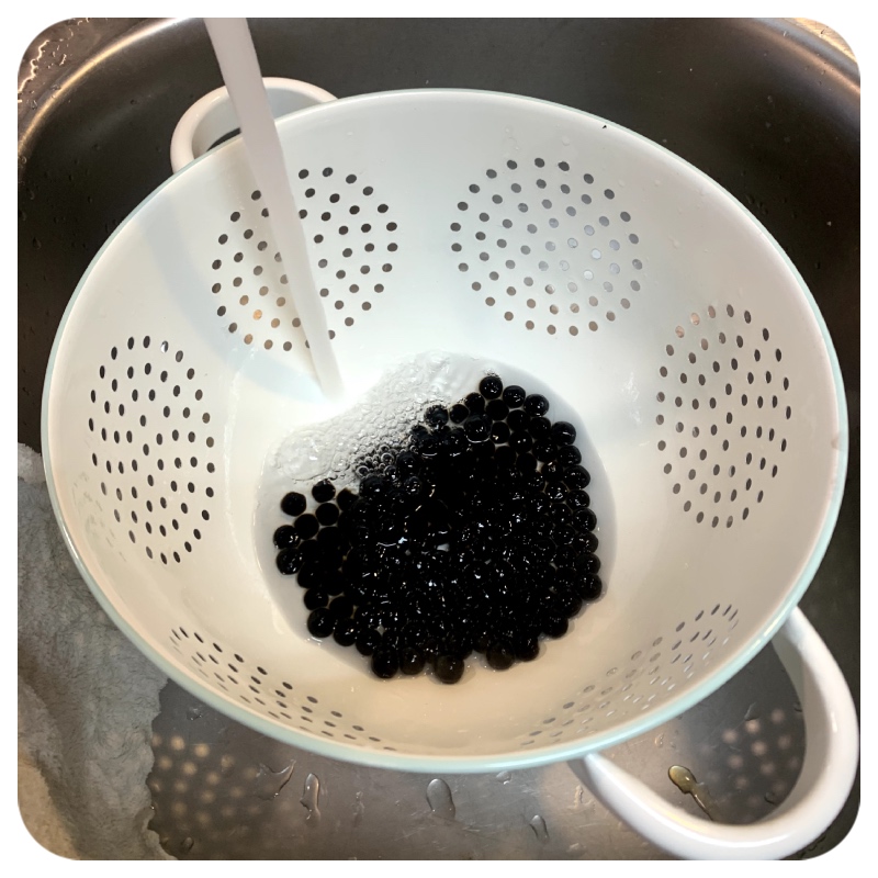 Image of Once the boba is cooked, drain and rinse it under...