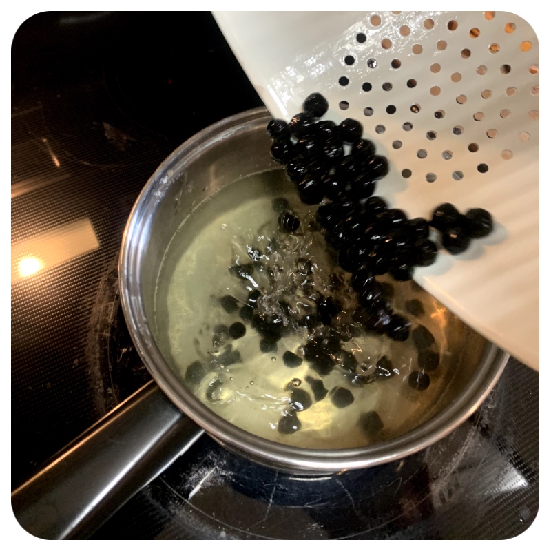 Image of Add the cooked boba to the honey water and let...