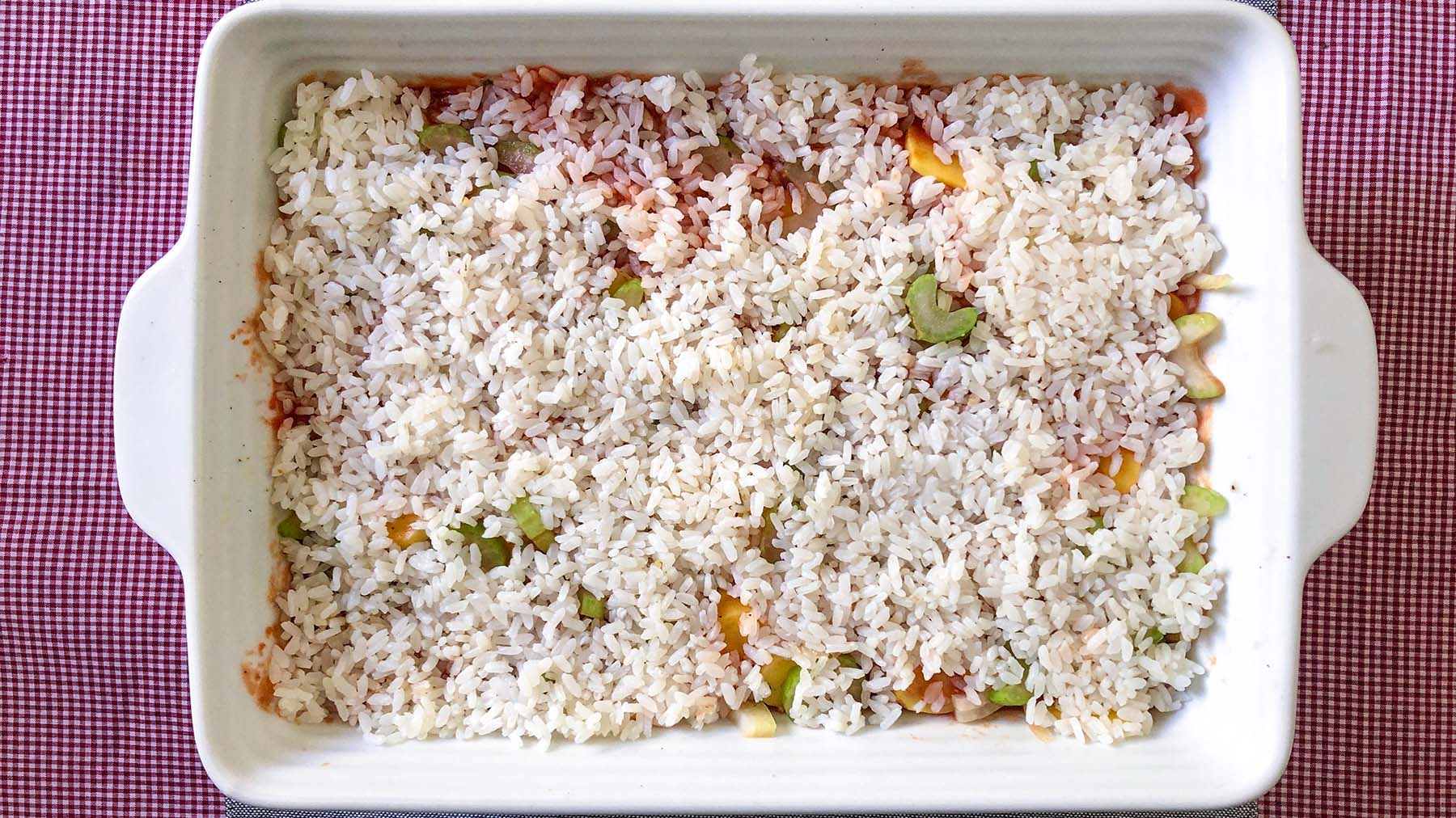 Image of Spread an even layer of rice. Season again with salt...