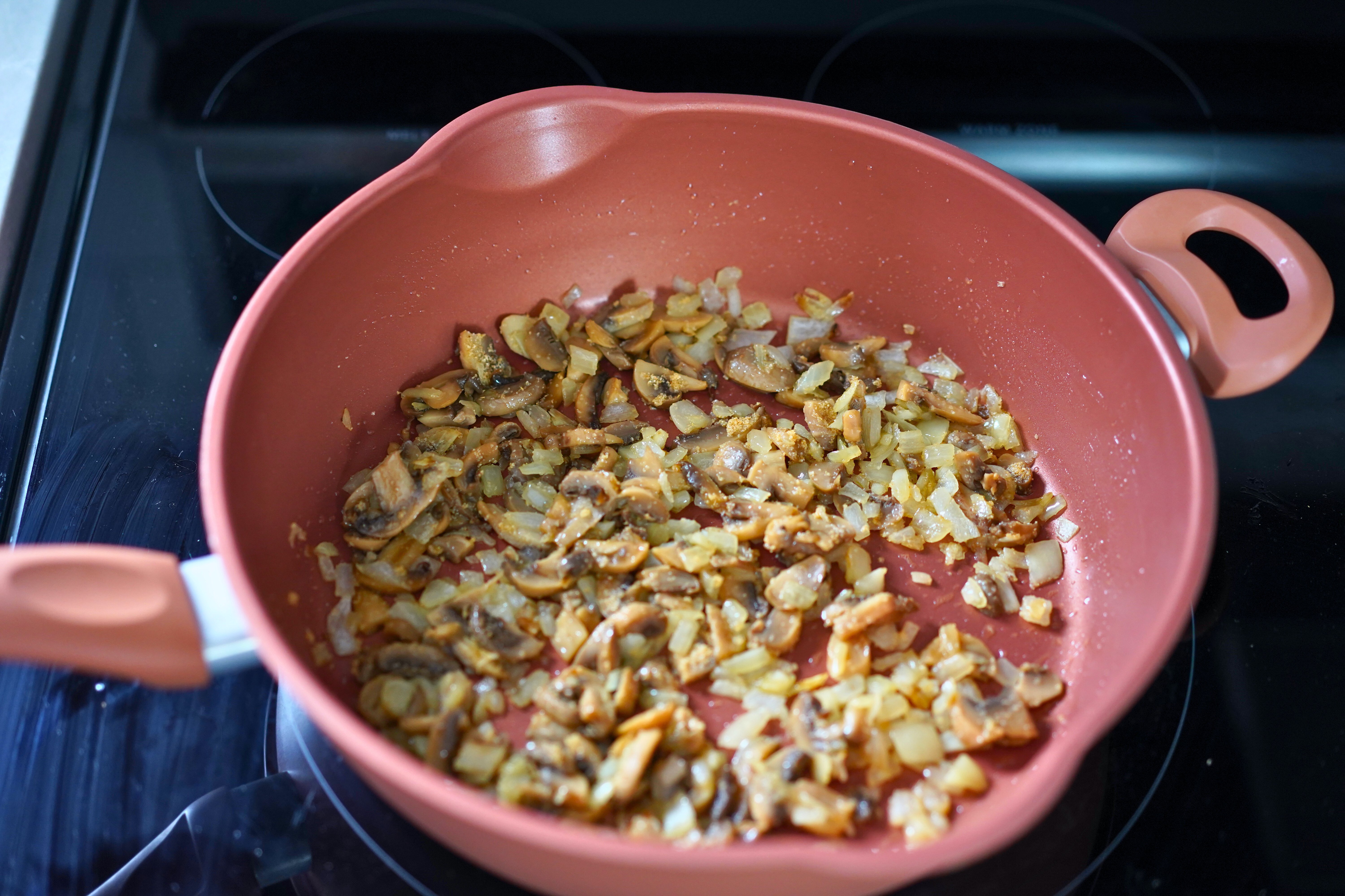 Image of Sauté onions and mushrooms on medium-low heat in Wild Mushroom...