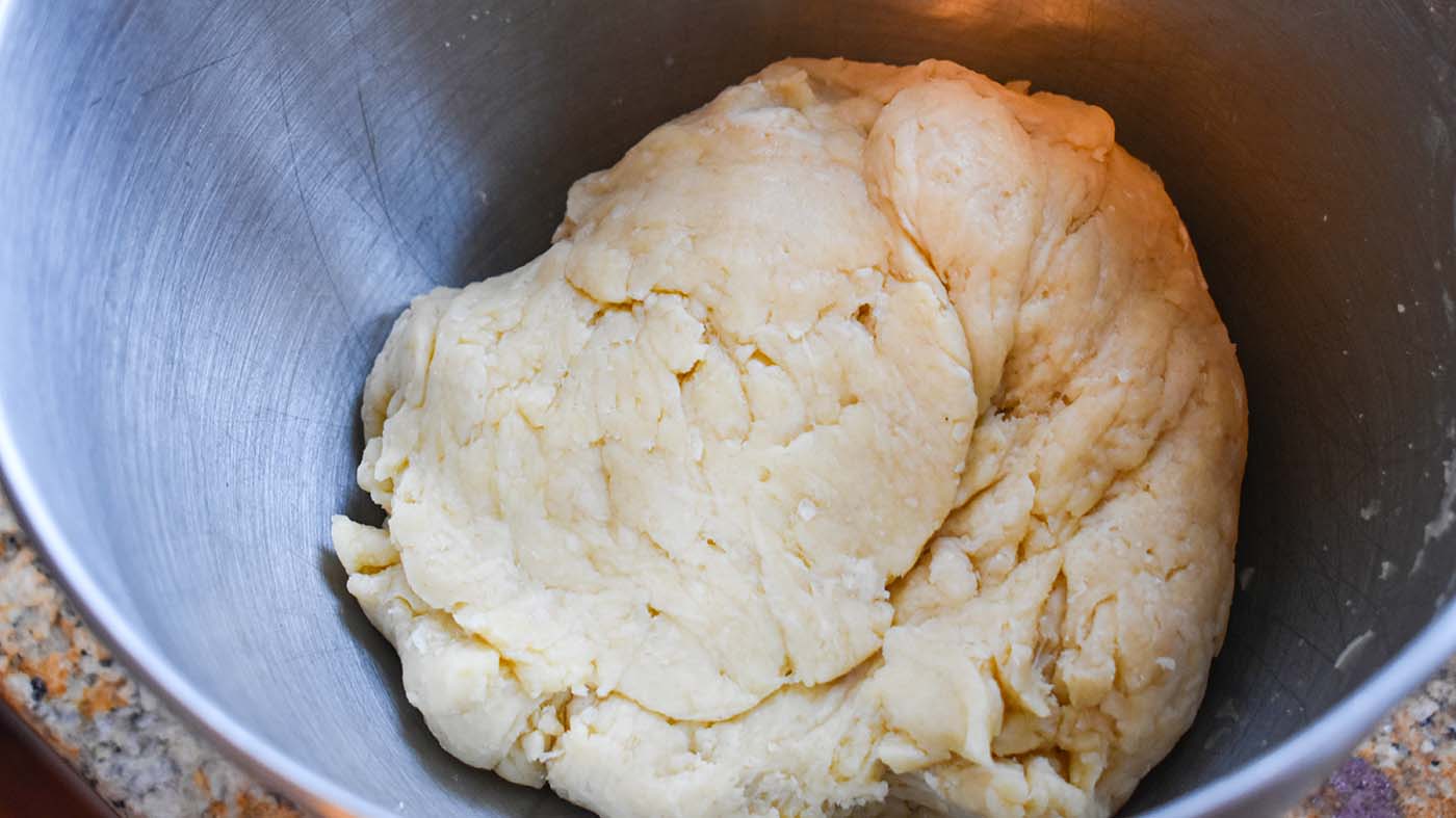 Image of Add egg, vinegar, water, and mix. Squeeze with hands to...