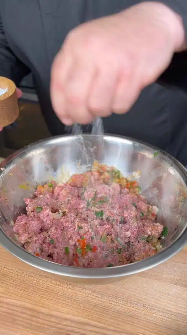 Image of In a large mixing bowl, combine eggs, milk, and breadcrumbs....