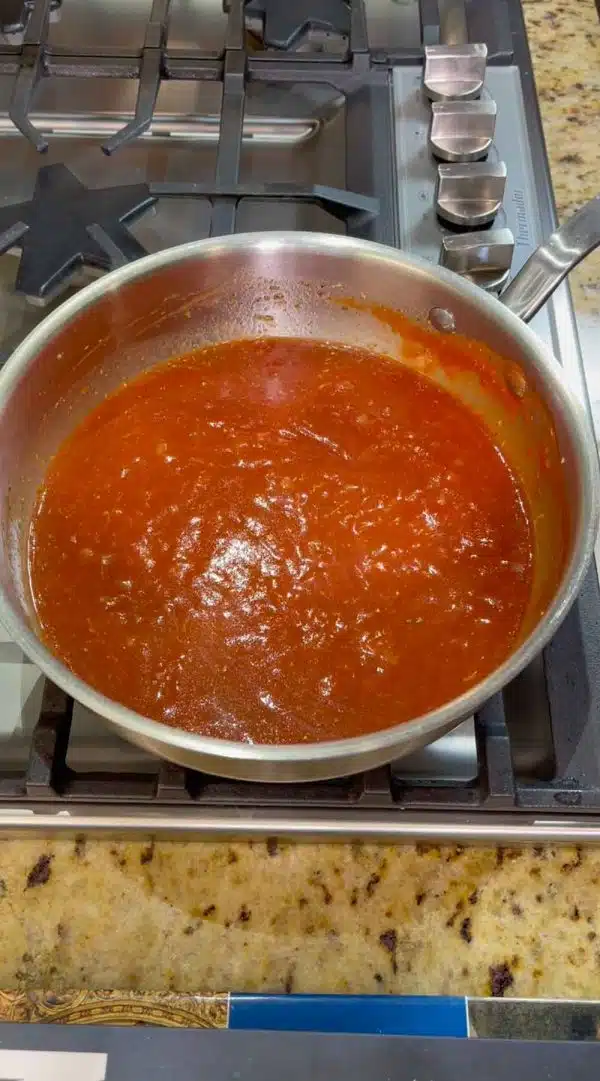 Image of Combine in a sauce pan, the olive oil, onions, garlic,...