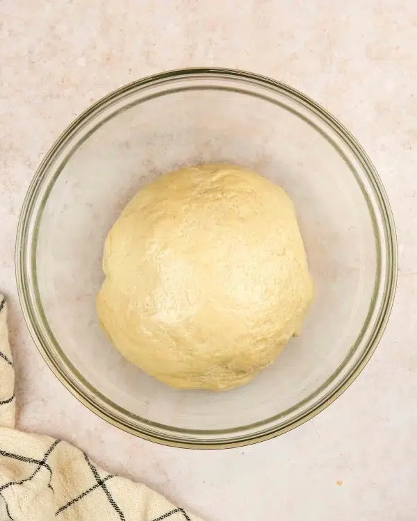 Image of Using the knead attachment, pour the activated yeast mixture into...