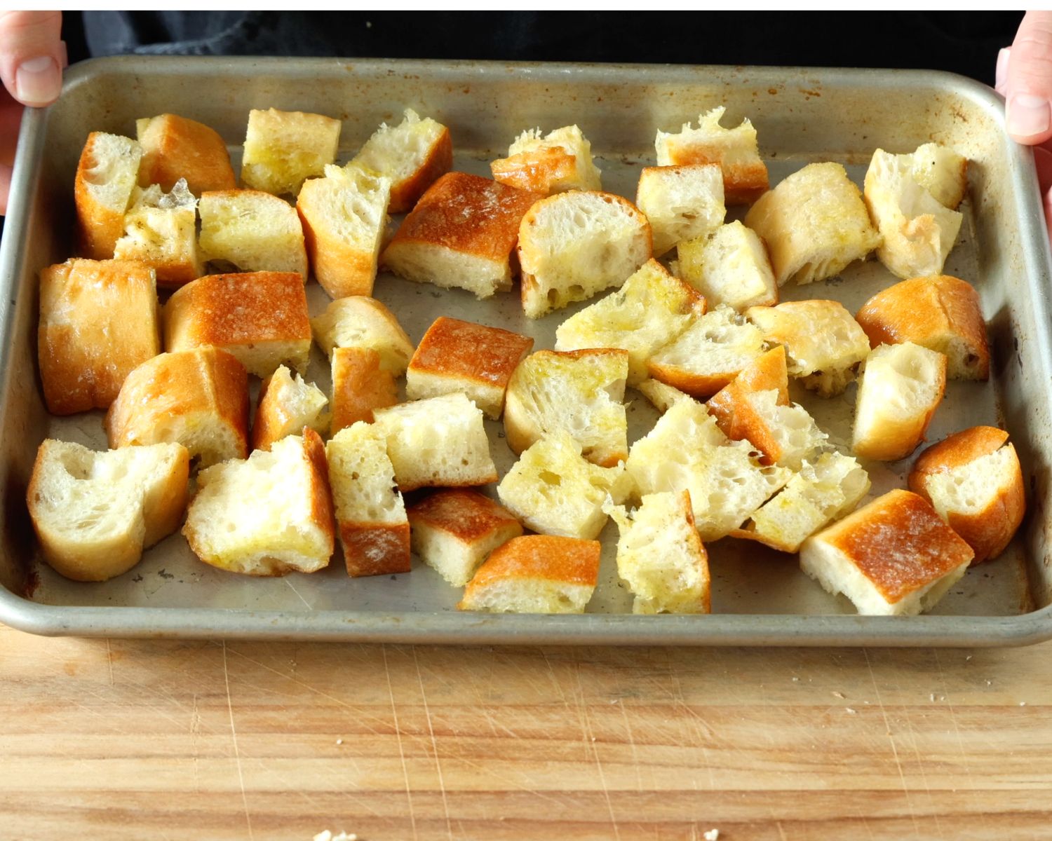 Image of Cut the baguette into bite-sized cubes. In a bowl, drizzle...