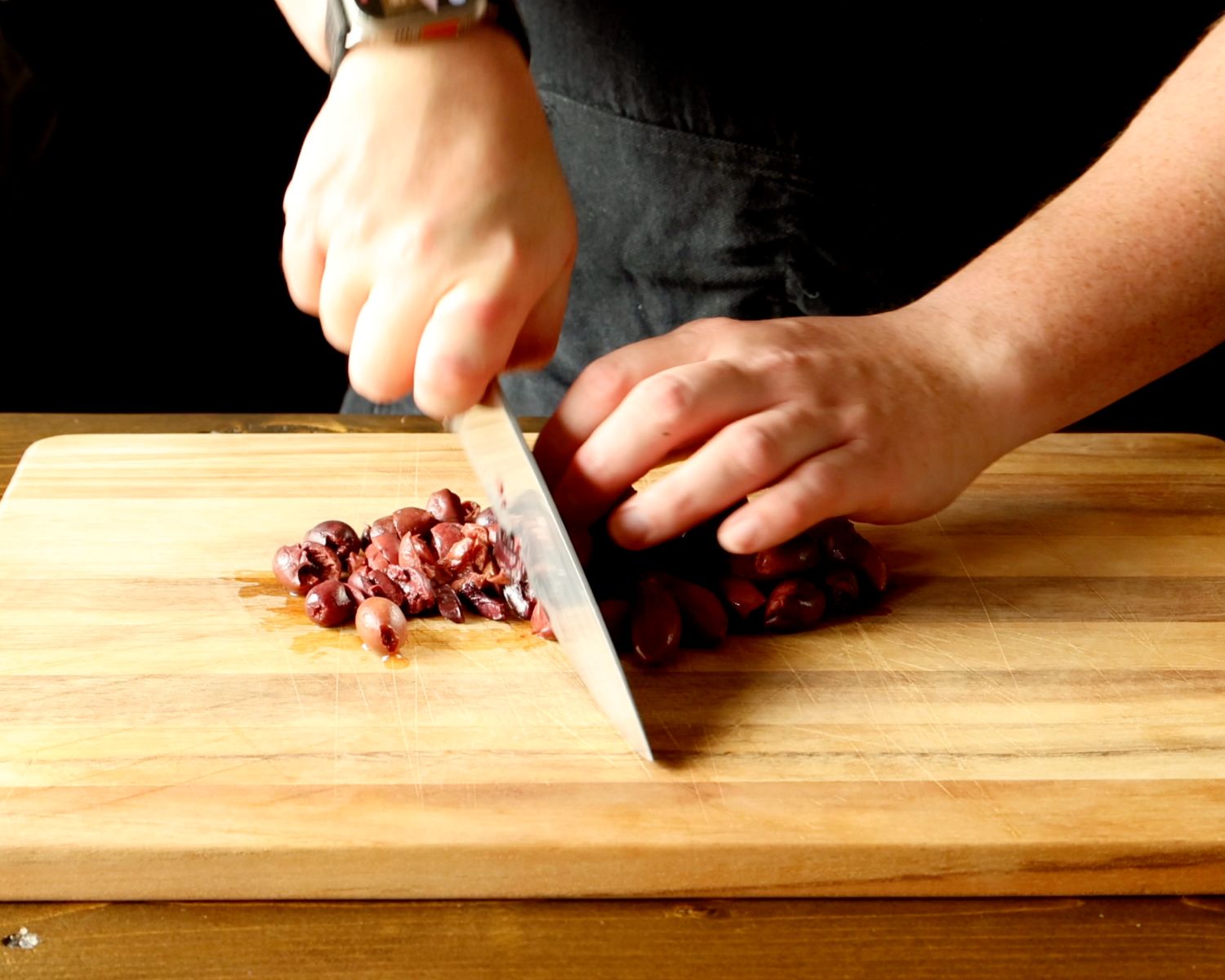 Image of Place the olives on a cutting board and roughly chop...