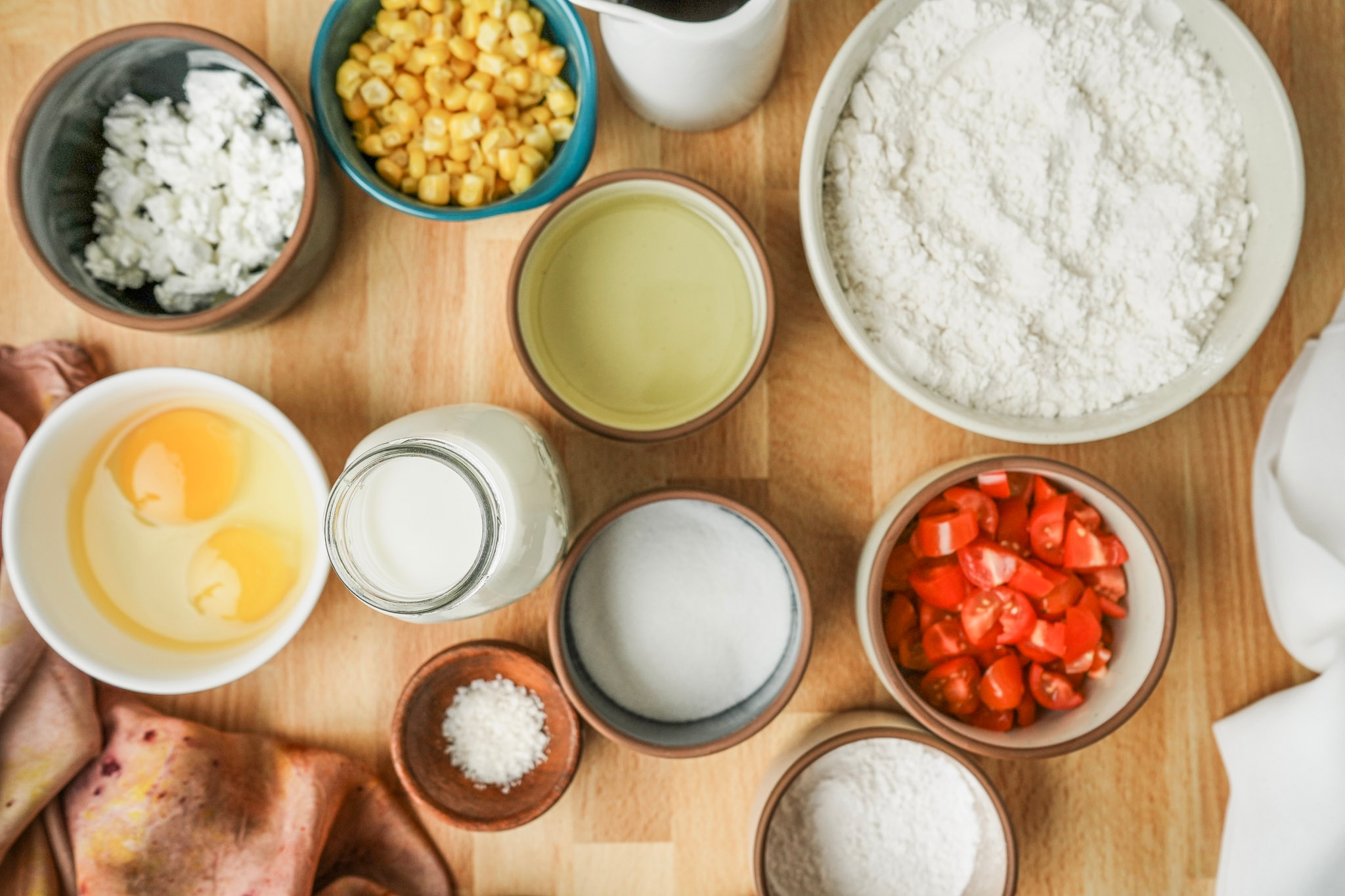 Image of In a mixing bowl combine the corn, feta, tomato, olive...