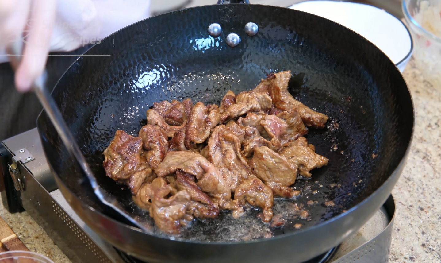 Image of Heat the wok until smoking hot and add a generous...