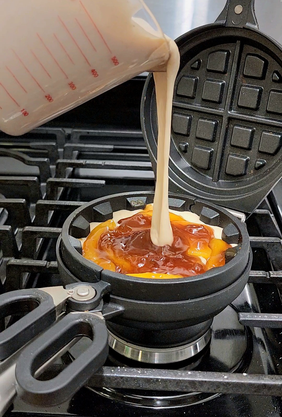 Image of Proceed to cover the filling with the waffle batter.