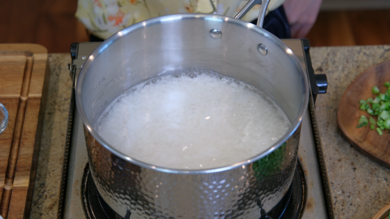 Image of Add the rice and water to a saucepan and bring...