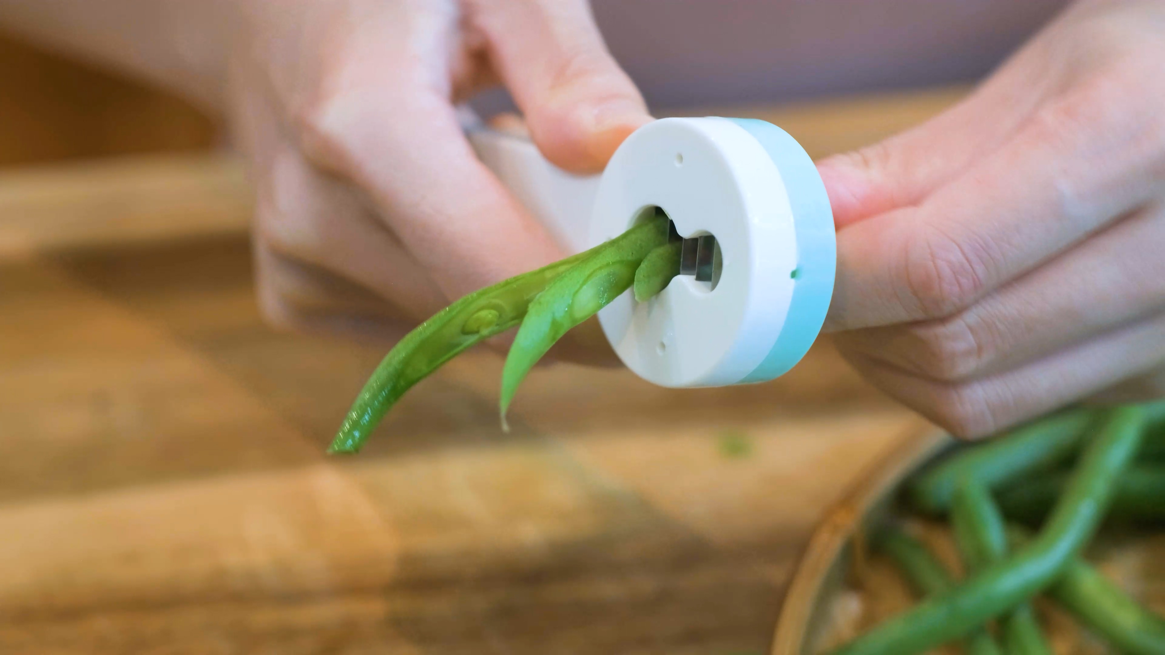 Image of Push all the green beans through the tool and split...