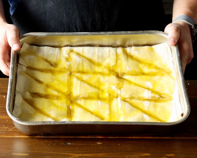 Image of While it is baking, strain the syrup to remove cinnamon...