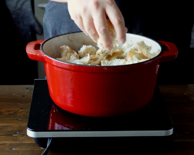 Image of Add about ⅓ of the torn bread and cook, stirring...