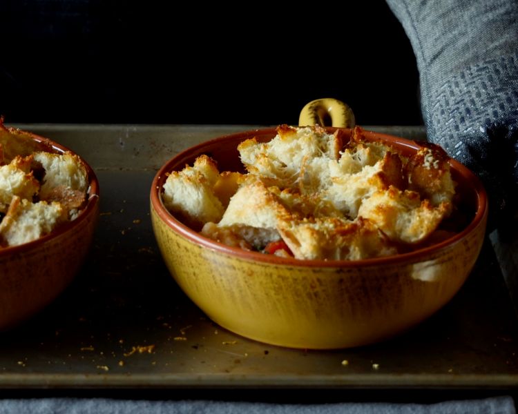 Image of Transfer to oven and bake stew until thick, bubbling, and...